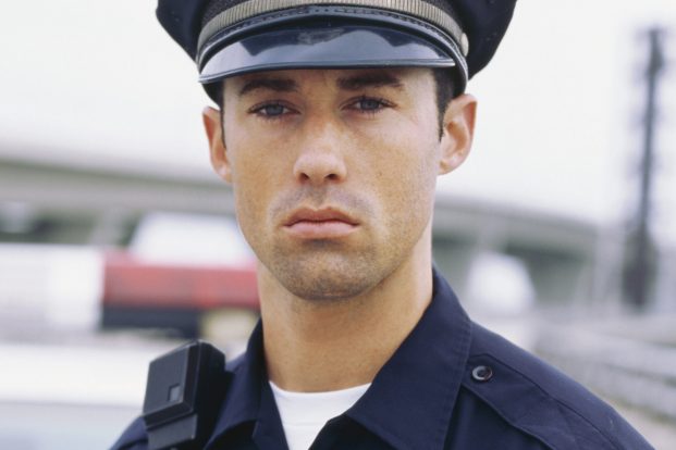 Close-up view of a policeman standing